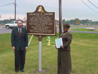 Mayor Joey Normand and Carolyn Brown, Grambling alumna, dedicate the Charles P. Adams historic marker at the Brusly Town Memorial Plaza