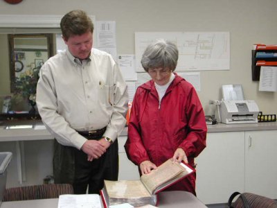 Brusly Councilwoman Joanne Bourgeois inspects Town records upon delivery